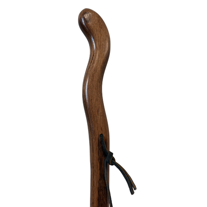 Brazos Twisted Oak Backpacker Walking Stick upper section showing curved handle, natural wood grain twist, and black leather wrist strap on white background