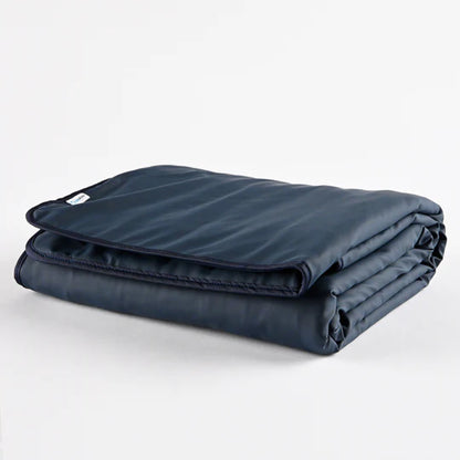 CapeAble®Care Medical Weighted Blanket folded in navy blue, made with medical-grade Sure-Chek fabric and SmartWeight® Technology for deep pressure therapy