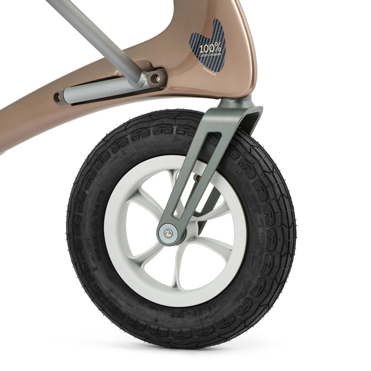 Close-up of a rollator wheel with a white rim and black tire on a beige frame.