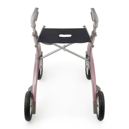 A pink manual walker with a black seat, silver metal frame, and four wheels, shown from a front-facing perspective on a white background.