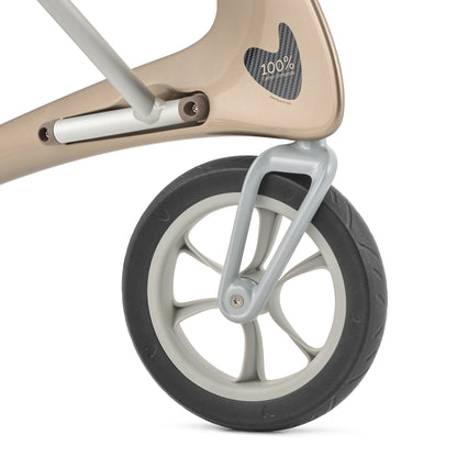 Close-up of a rollator wheel with a beige frame on a white background