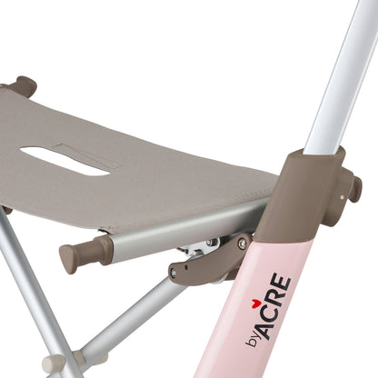 Side of pink rollator on white background
