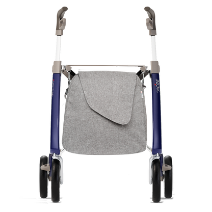 A rollator walker with a gray fabric storage bag hanging from the frame, featuring blue-purple metal legs, gray handlebars, and black wheels, shown against a plain white background.