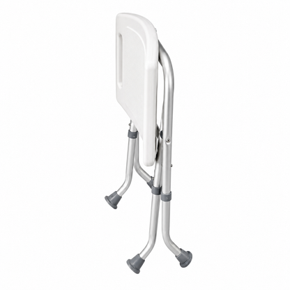 Folded Drive shower bench with compact space-saving design, adjustable aluminum legs, and slip-resistant rubber feet for bath safety.