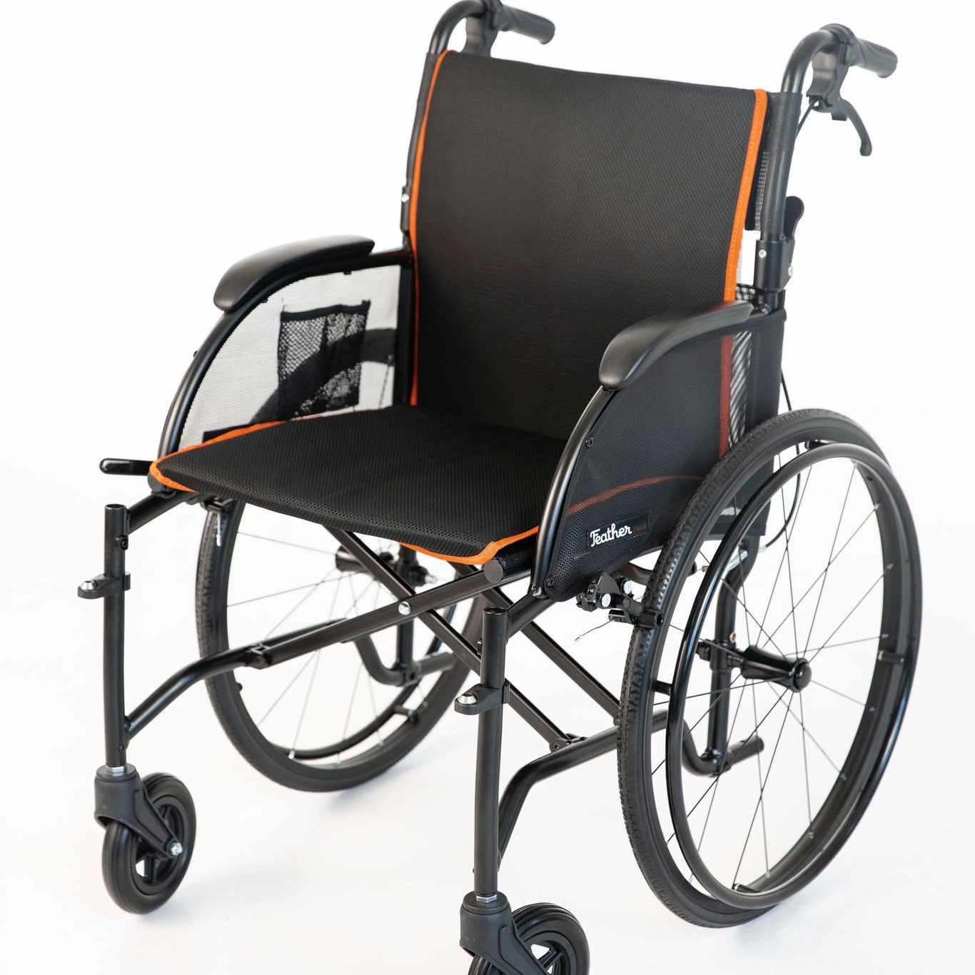 Wheelchair with black seat and orange accents on a white background