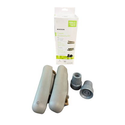 McKesson Crutch Accessory Kit with replacement underarm cushions and rubber crutch tips displayed beside product packaging for standard crutches.