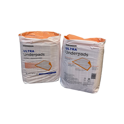 Front and back view of McKesson Ultra disposable underpads packaging with absorbent incontinence protection pads for surface coverage.