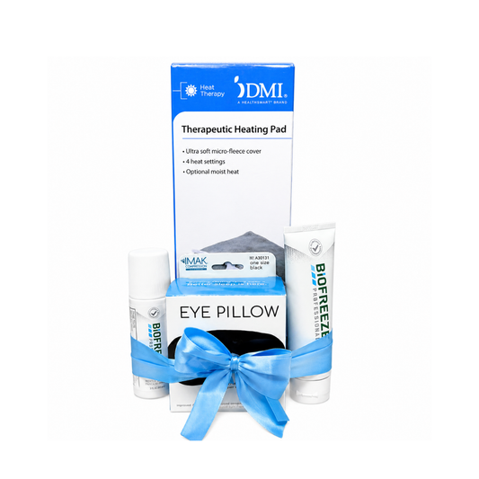 Therapeutic wellness gift bundle featuring a heating pad, eye pillow, Biofreeze roll-on, and Biofreeze gel wrapped together with a blue ribbon on a clean white background.