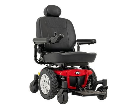 A power wheelchair with a black upholstered seat and headrest, black armrests, and a red front body panel, shown on a plain white background.