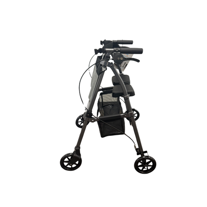 Stander Wonder Rollator Plus shown folded from the side, displaying compact storage profile with handles, brakes, and basket