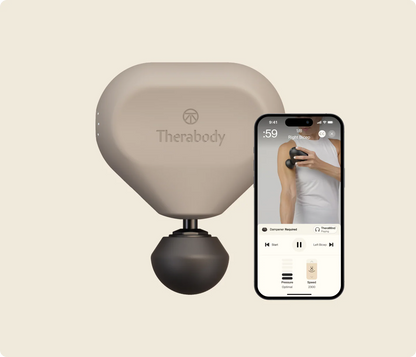 Theragun Mini 3.0 portable massage gun in oat color displayed beside smartphone app for guided muscle recovery and wellness routines.