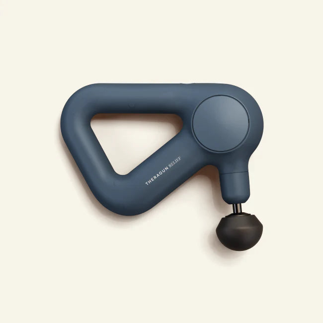 Theragun Relief percussion massage gun in navy blue designed for muscle recovery, tension relief, and everyday wellness support.