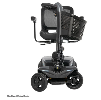 A black FDA Class II medical scooter with a high-back mesh seat, a front storage basket, and a control joystick on the left side, shown against a plain white background.