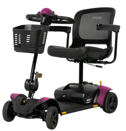 A black and purple GO-ERG mobility scooter with a built-in front basket, black mesh back seat, and three wheels, shown on a solid white background.