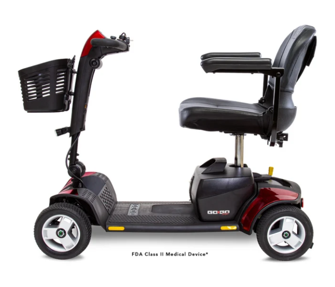 A mobility scooter with a black seat, black basket, and dark red body panels, shown from a side profile on a white background. The text 'FDA Class II Medical Device' is visible at the bottom.