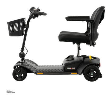 A black mobility scooter with a high-back seat, armrests, a front storage basket, and a step-through deck, shown on a plain white background. Small text in the lower-left corner reads 'FDH Class 8 Medical Device'.