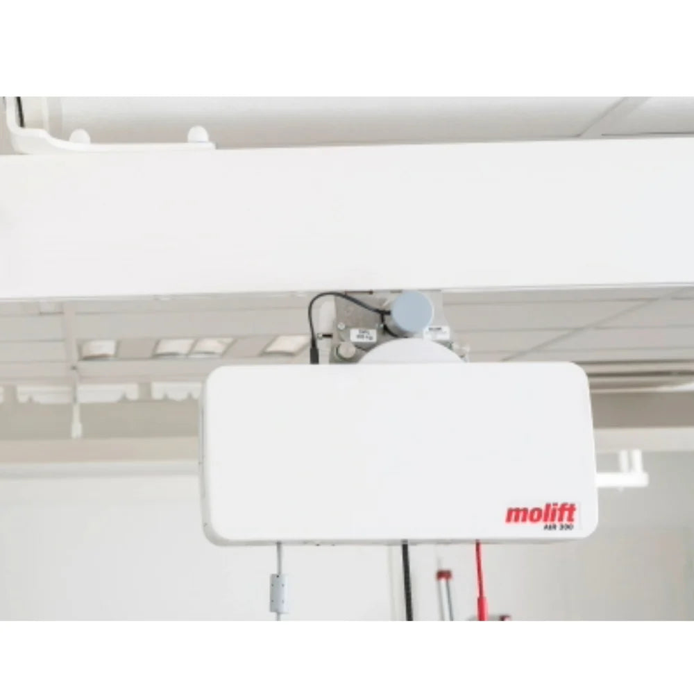 Molift Air 300 lifting motor mounted to an overhead rail