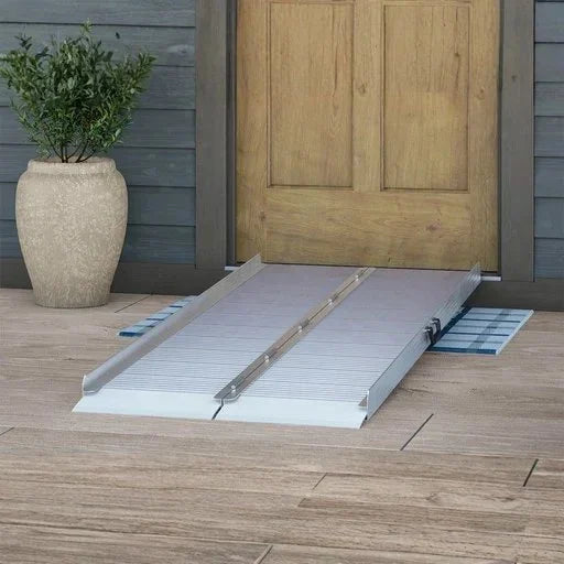 Bi-folding aluminum ramp placed at a front doorway