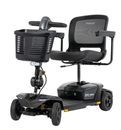 Black Pride Go-Go 2 electric mobility scooter with a front storage basket, mesh back seat, and rear wheels, shown on a solid white background.