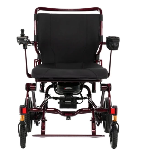 A rear-view electric wheelchair with a black padded seat and backrest, a dark red metal frame, and black wheels, shown on a plain white background.