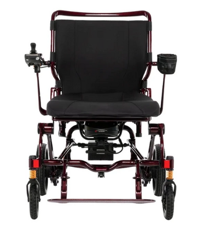 A rear-view electric wheelchair with a black padded seat and backrest, a dark red metal frame, and black wheels, shown on a plain white background.