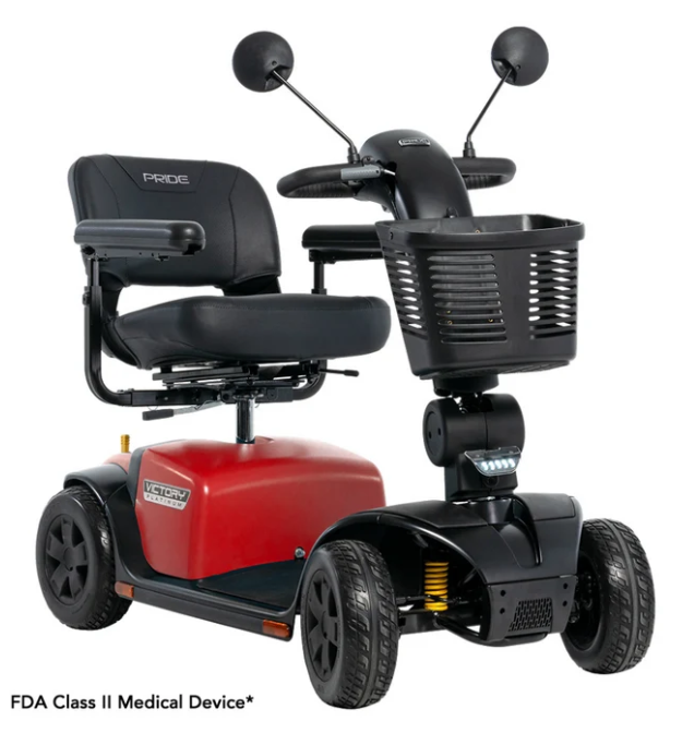 A red and black Pride mobility scooter with a front basket, black seat, and four wheels, shown on a white background with the text 'FDA Class II Medical Device' at the bottom.