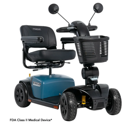 A blue and black Pride Mobility Class II medical scooter with a front basket, black seat, and mirrors, shown on a white background with FDA Class II Medical Device text below.