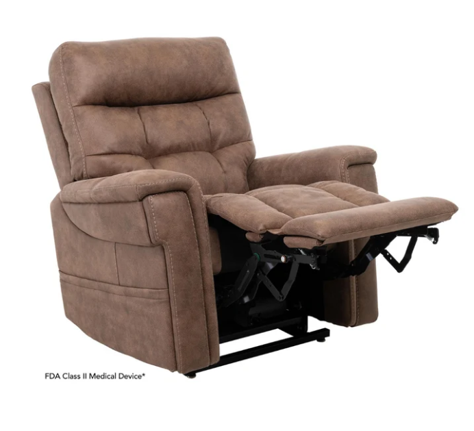 A brown upholstered recliner chair with the footrest extended, shown on a plain white background. Small text at the bottom left reads 'FDA Class II Medical Device'.